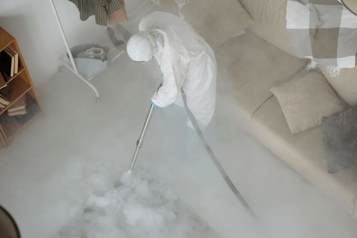 Biohazard cleanup technician in protective equipment, West Hollywood, CA
